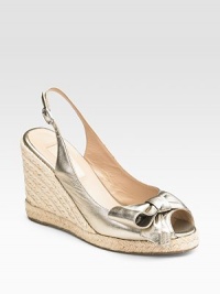 Shimmery metallic leather wraps into a lovely bow at the peep toe.Roped wedge, 4 (100mm) Roped platform, ¾ (20mm) Compares to a 3¼ heel, (80mm) Adjustable ankle strap Leather lining Padded insole Rubber sole Made in ItalyOUR FIT MODEL RECOMMENDS ordering true whole size; ½ sizes should order the next whole size up. Shimmery metallic leather wraps into a lovely bow at the peep toe.Roped wedge, 4 (100mm) Roped platform, ¾ (20mm) Compares to a 3¼ heel, (80mm) Adjustable ankle strap Leather lining Padded insole Rubber sole Made in ItalyOUR FIT MODEL RECOMMENDS ordering true whole size; ½ sizes should order the next whole size up.