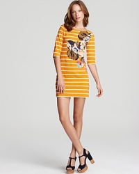 An oversize floral graphic packs a color punch on this cheerfully striped French Connection dress. An oversize floral graphic packs a color punch on this cheerfully striped French Connection dress.