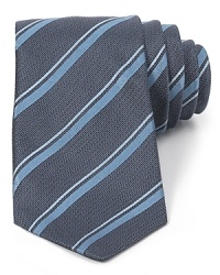 Lively up your look with a handsome skinny tie adorned with colorful stripes and cut in premium silk for an ultra-soft hand. Lively up your look with a handsome skinny tie adorned with colorful stripes and cut in premium silk for an ultra-soft hand.