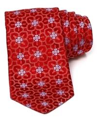 A subtle floral print takes form on luxe silk with this classic tie from Ike Behar. A subtle floral print takes form on luxe silk with this classic tie from Ike Behar.
