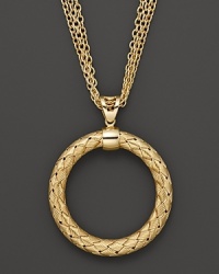 Multiple chains flank an intricately woven yellow silver pendant from Fifth Season by Roberto Coin. Multiple chains flank an intricately woven yellow silver pendant from Fifth Season by Roberto Coin.