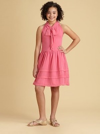 She'll want to play dress up in this charming frock of chiffon tiers, a sweet bow and full skirt.Jewel neckline with bowSleevelessSide zipperFull skirtPolyesterHand wash cold or dry cleanImported She'll want to play dress up in this charming frock of chiffon tiers, a sweet bow and full skirt.Jewel neckline with bowSleevelessSide zipperFull skirtPolyesterHand wash cold or dry cleanImported