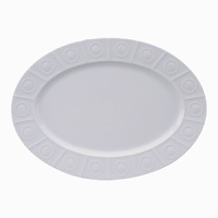 Modern in design with a raised circular pattern, made from French Limoges Porcelain. Dishwasher and microwave safe. Modern in design with a raised circular pattern, made from French Limoges Porcelain. Dishwasher and microwave safe.