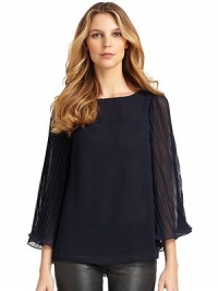 THE LOOKPleated chiffon batwing sleevesBack keyhole with button closureTHE FITAbout 25 from shoulder to hemTHE MATERIALPolyesterCARE & ORIGINDry cleanImportedModel shown is 5'9 (175cm) wearing US size Small.This item was originally available for purchase at Saks Fifth Avenue OFF 5TH stores 