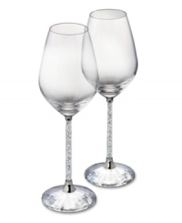 Make it a memorable dining experience with Swarovski Crystalline wine glasses. A faceted base, polished metal accents and stems filled with glittering chatons turn an ordinary meal into cause for celebration. Make it a memorable dining experience with Swarovski Crystalline wine glasses. A faceted base, polished metal accents and stems filled with glittering chatons turn an ordinary meal into cause for celebration.