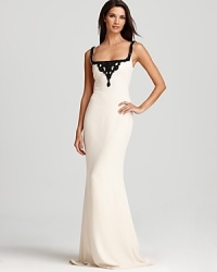 Jet black beading lends a dramatic, sophisticated look to this Badgley Mischka gown, crafted in a timeless, neutral hue. Jet black beading lends a dramatic, sophisticated look to this Badgley Mischka gown, crafted in a timeless, neutral hue.
