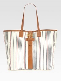 Set sail with this nautical-inspired design made of rich striped canvas, finished with sumptuous leather top handles and trim. Double leather top handles, 9 dropBuckled magnetic flap closure with logo emblemOne inside zip pocketTwo inside open pockets15W X 13H X 5½DImported Set sail with this nautical-inspired design made of rich striped canvas, finished with sumptuous leather top handles and trim. Double leather top handles, 9 dropBuckled magnetic flap closure with logo emblemOne inside zip pocketTwo inside open pockets15W X 13H X 5½DImported