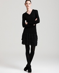 Rolling with ruffles, this DKNY sweater dress infuses your everyday style with youthful joie de vivre. Polish off the playful silhouette with chic black tights. Rolling with ruffles, this DKNY sweater dress infuses your everyday style with youthful joie de vivre. Polish off the playful silhouette with chic black tights.