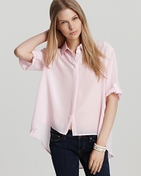 Pretty in pink, this silk Amanda Uprichard shirt takes on the high/low trend and masters it! The airy look is complete with elbow sleeves, keeping things lightweight as the temps rise. Pretty in pink, this silk Amanda Uprichard shirt takes on the high/low trend and masters it! The airy look is complete with elbow sleeves, keeping things lightweight as the temps rise.