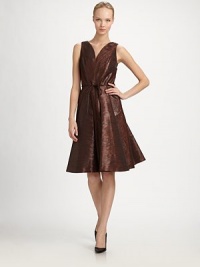 Boasting a gorgeous sheen, rounded v-neck and waist tie, this stunning, ultra-feminine cocktail dress will help you make your entrance.V-neckSleevelessConcealed back zipperWaist tiePleated skirtSilk liningAbout 26 from natural waist67% polyester/33% cottonDry cleanMade in USA of Italian fabric Model shown is 5'11 wearing US size 4. Boasting a gorgeous sheen, rounded v-neck and waist tie, this stunning, ultra-feminine cocktail dress will help you make your entrance.V-neckSleevelessConcealed back zipperWaist tiePleated skirtSilk liningAbout 26 from natural waist67% polyester/33% cottonDry cleanMade in USA of Italian fabric Model shown is 5'11 wearing US size 4.