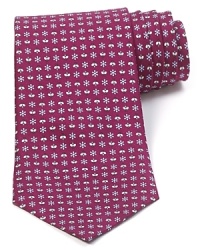 Daisies and bees flourish on this lushly colored tie from Salvatore Ferragamo, rendered in super-soft Italian silk for a lavish look and feel. Daisies and bees flourish on this lushly colored tie from Salvatore Ferragamo, rendered in super-soft Italian silk for a lavish look and feel.