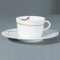 For over two centuries Raynaud has created unique Limoges porcelain, with a marked preference for relief shapes and generously colored and gilt decorations. Metamorphoses is a striking pattern of red and gold with a butterfly motif. For over two centuries Raynaud has created unique Limoges porcelain, with a marked preference for relief shapes and generously colored and gilt decorations. Metamorphoses is a striking pattern of red and gold with a butterfly motif.