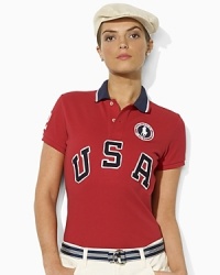 An essential short-sleeved polo shirt is crafted in breathable cotton mesh with bold country embroidery, celebrating Team USA's participation in the 2012 Olympics. An essential short-sleeved polo shirt is crafted in breathable cotton mesh with bold country embroidery, celebrating Team USA's participation in the 2012 Olympics.