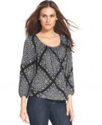 MICHAEL Michael Kors' pretty printed top features elastic at the cuffs and hem for a breezy fit and is the perfect finish to a pair of chic bootcut jeans. MICHAEL Michael Kors' pretty printed top features elastic at the cuffs and hem for a breezy fit and is the perfect finish to a pair of chic bootcut jeans.
