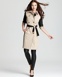 Supple leather sleeves lend untamed urban edge to a classic MICHAEL Michael Kors trench coat for the perfect punk-meets-prep style mix. Supple leather sleeves lend untamed urban edge to a classic MICHAEL Michael Kors trench coat for the perfect punk-meets-prep style mix.