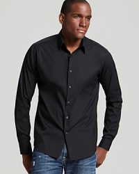 This handsome slim fit sport shirt is crafted with a touch of stretch, for an extra sleek silhouette. This handsome slim fit sport shirt is crafted with a touch of stretch, for an extra sleek silhouette.