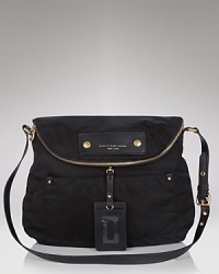 MARC BY MARC JACOBS' ever-cool crossbody -- this season's wardrobe essential -- rendered in urbane nylon. MARC BY MARC JACOBS' ever-cool crossbody -- this season's wardrobe essential -- rendered in urbane nylon.