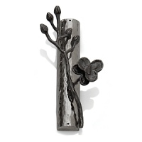Intricate and alluring, Michael Aram's Black Orchid collection evokes nature at its best. Says the designer, There is a velvety luxury - an almost gothic quality - to representing orchids in blackened nickel. To me, the pieces feel seductive and graceful, yet dark and unexpected. Intricate and alluring, Michael Aram's Black Orchid collection evokes nature at its best. Says the designer, There is a velvety luxury - an almost gothic quality - to representing orchids in blackened nickel. To me, the pieces feel seductive and graceful, yet dark and unexpected.