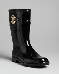 These abbreviated Love Moschino rain boots are right in step with the latest, wet-weather trend: glossy rubber punctuated with bold, gold hardware. These abbreviated Love Moschino rain boots are right in step with the latest, wet-weather trend: glossy rubber punctuated with bold, gold hardware.