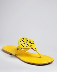 You'll flip for these Tory Burch thong sandals that pop in boldly dramatic color with cut out logo accents. You'll flip for these Tory Burch thong sandals that pop in boldly dramatic color with cut out logo accents.