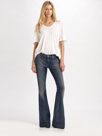 Curve-hugging flares with a low-rise waist in subtly sanded stretch denim.THE FITFitted through hips and thighsRise, about 8Inseam, about 35THE DETAILSZip flyFive-pocket style98% cotton/2% spandexMachine washMade in USA of imported fabricModel shown is 5'9 (175cm) wearing US size 4. Curve-hugging flares with a low-rise waist in subtly sanded stretch denim.THE FITFitted through hips and thighsRise, about 8Inseam, about 35THE DETAILSZip flyFive-pocket style98% cotton/2% spandexMachine washMade in USA of imported fabricModel shown is 5'9 (175cm) wearing US size 4.