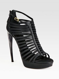 Plethora of rich leather straps with an exposed back zipper, elevated by a platform and horn heel. Horn heel, 5 (125mm)Covered platform, 1 (25mm)Compares to a 4 heel (100mm)Leather upperBack zipperLeather lining and solePadded insoleMade in ItalyOUR FIT MODEL RECOMMENDS ordering true size. Plethora of rich leather straps with an exposed back zipper, elevated by a platform and horn heel. Horn heel, 5 (125mm)Covered platform, 1 (25mm)Compares to a 4 heel (100mm)Leather upperBack zipperLeather lining and solePadded insoleMade in ItalyOUR FIT MODEL RECOMMENDS ordering true size.