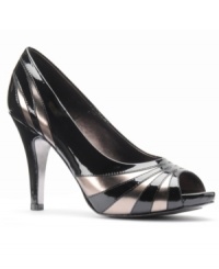 Isola's Tillen platform pumps are super shiny. The silver and black pattern creates a unique glam look that will go great with flirty dresses. Isola's Tillen platform pumps are super shiny. The silver and black pattern creates a unique glam look that will go great with flirty dresses.