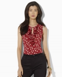 A classic cotton jersey tank becomes a chic summer essential with a pretty allover floral pattern and flirty ruffles at the front. A classic cotton jersey tank becomes a chic summer essential with a pretty allover floral pattern and flirty ruffles at the front.