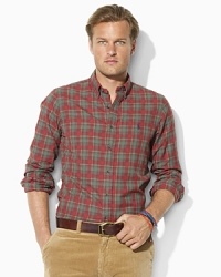 A trim sport shirt is woven from soft cotton twill and adorned with a preppy plaid print and Ralph Lauren's embroidered pony for a look that exudes rustic refinement. A trim sport shirt is woven from soft cotton twill and adorned with a preppy plaid print and Ralph Lauren's embroidered pony for a look that exudes rustic refinement.