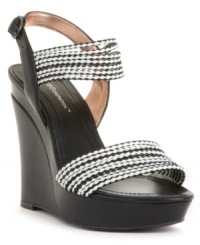 A fierce style to add to your shoe collection. BCBGeneration pairs a towering platform with braided leather straps to create this must-have look. A fierce style to add to your shoe collection. BCBGeneration pairs a towering platform with braided leather straps to create this must-have look.