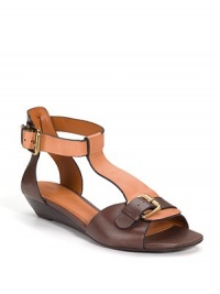 THE LOOKOpen toe with buckle detail Adjustable ankle strapTHE FITStacked wedge heel, 1¼ (30mm)THE MATERIALLeather lining and sole Padded insoleORIGINImportedOUR FIT MODEL RECOMMENDS ordering one half size up as this style runs small. THE LOOKOpen toe with buckle detail Adjustable ankle strapTHE FITStacked wedge heel, 1¼ (30mm)THE MATERIALLeather lining and sole Padded insoleORIGINImportedOUR FIT MODEL RECOMMENDS ordering one half size up as this style runs small.