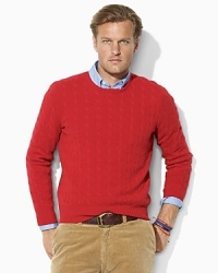A refined crewneck sweater is knit from sumptuously soft cashmere for a handsome, preppy look. A refined crewneck sweater is knit from sumptuously soft cashmere for a handsome, preppy look.