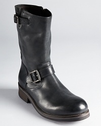 These ultra-hip boots give you an edgy look, outfitted with silver-tone buckles and a thick, rugged zipper for rocker appeal. These ultra-hip boots give you an edgy look, outfitted with silver-tone buckles and a thick, rugged zipper for rocker appeal.