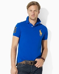 Steeped in sporty heritage, this trim-fitting polo shirt is crafted from breathable cotton mesh with iconic, athletic-inspired embroidery. Steeped in sporty heritage, this trim-fitting polo shirt is crafted from breathable cotton mesh with iconic, athletic-inspired embroidery.