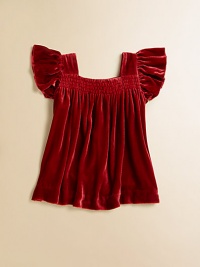 A rich, shimmery velvet top, accented with fluttery sleeves and smocking, is perfect for holiday gatherings.SquareneckFlutter cap sleevesPullover styleFully linedRayon/SilkDry cleanImported A rich, shimmery velvet top, accented with fluttery sleeves and smocking, is perfect for holiday gatherings.SquareneckFlutter cap sleevesPullover styleFully linedRayon/SilkDry cleanImported