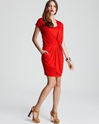 Fluid draping lends fiery dimension to this standout DKNY dress. Garnish with gold accents and set your cocktail style afire. Fluid draping lends fiery dimension to this standout DKNY dress. Garnish with gold accents and set your cocktail style afire.