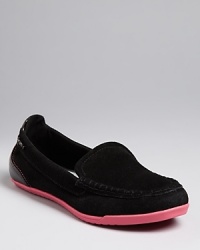 Bright soles pop against dark suede in these athletic-influenced DKNY loafers, the perfect slip on for performing your about-town to-do's in style. Bright soles pop against dark suede in these athletic-influenced DKNY loafers, the perfect slip on for performing your about-town to-do's in style.