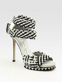Elevated by a skinny heel and island platform, complexly woven leather straps are backed by a tassel and back zipper. Self-covered heel, 5 (125mm)Island platform, 1 (25mm)Compares to a 4 heel (100mm)Woven leather upperBack zipperLeather lining and solePadded insoleImportedOUR FIT MODEL RECOMMENDS ordering one half size up as this style runs small. Elevated by a skinny heel and island platform, complexly woven leather straps are backed by a tassel and back zipper. Self-covered heel, 5 (125mm)Island platform, 1 (25mm)Compares to a 4 heel (100mm)Woven leather upperBack zipperLeather lining and solePadded insoleImportedOUR FIT MODEL RECOMMENDS ordering one half size up as this style runs small.