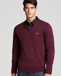 Address the holes in your sweater collection with a new V-neck from Fred Perry, featuring the signature crest on the left chest to foreground your classic taste. Crafted in a soft blend of merino wool and cotton for durability. Address the holes in your sweater collection with a new V-neck from Fred Perry, featuring the signature crest on the left chest to foreground your classic taste. Crafted in a soft blend of merino wool and cotton for durability.