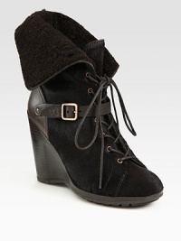 Dyed calf hair and leather wedge with a lace-up front, buckle detail and fold-over shearling cuff. Stacked wedge, 4 (100mm)Covered platform, ½ (15mm)Compares to a 3½ heel (90mm)Dyed calf hair and leather upperShearling liningRubber solePadded insoleMade in Italy Dyed calf hair and leather wedge with a lace-up front, buckle detail and fold-over shearling cuff. Stacked wedge, 4 (100mm)Covered platform, ½ (15mm)Compares to a 3½ heel (90mm)Dyed calf hair and leather upperShearling liningRubber solePadded insoleMade in Italy