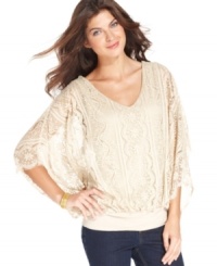 Add a romantic feel to your next outfit with this lace top from Grace Elements.