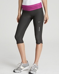 Amp up your active wear with these Nike low-rise capri pants, a vibrant magenta waistband finishes a sleek silhouette for a win-win addition to your active wear. Made with Nike's Dri-FIT technology to wick moisture away from the skin. Amp up your active wear with these Nike low-rise capri pants, a vibrant magenta waistband finishes a sleek silhouette for a win-win addition to your active wear. Made with Nike's Dri-FIT technology to wick moisture away from the skin.
