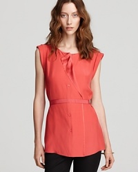 Petal-soft silk lends vibrant movement to a ruffled Lafayette 148 New York blouse, finished with a ribbon belt for feminine sophistication. Petal-soft silk lends vibrant movement to a ruffled Lafayette 148 New York blouse, finished with a ribbon belt for feminine sophistication.