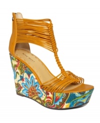 Get in an island state of mind. The Lightenup sandals by Nine West burst with floral color at the sky-high wedge, while the unique strap design stuns onlookers. Get in an island state of mind. The Lightenup sandals by Nine West burst with floral color at the sky-high wedge, while the unique strap design stuns onlookers.