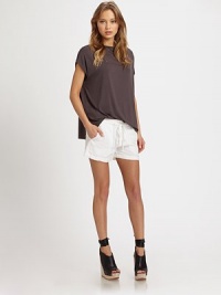 Slouchy, versatile jersey scoopneck can be worn tucked in for a more sophisticated ensemble. ScoopneckShort sleevesSplit hi-low hem hits below the hips95% micro modal/5% spandexDry cleanImportedModel shown is 5'10 (177cm) wearing US size Small. Slouchy, versatile jersey scoopneck can be worn tucked in for a more sophisticated ensemble. ScoopneckShort sleevesSplit hi-low hem hits below the hips95% micro modal/5% spandexDry cleanImportedModel shown is 5'10 (177cm) wearing US size Small.