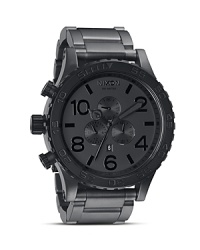 Stealthy and sleek. Nixon's oversized stainless steel watch is a cool choice for those who like to fly under the radar. Slip it on with a trench to be double-oh chic. Stealthy and sleek. Nixon's oversized stainless steel watch is a cool choice for those who like to fly under the radar. Slip it on with a trench to be double-oh chic.