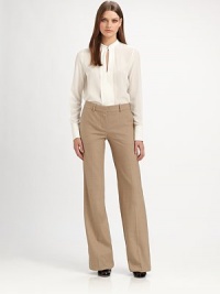 Artfully tailored silk chiffon, finished with an alluring front vent.Band collar with clasp closureFront ventLong pleated sleeves with button cuffsInverted back pleatSilkDry cleanImportedModel shown is 5'10 (177cm) wearing US size 4. Artfully tailored silk chiffon, finished with an alluring front vent.Band collar with clasp closureFront ventLong pleated sleeves with button cuffsInverted back pleatSilkDry cleanImportedModel shown is 5'10 (177cm) wearing US size 4.