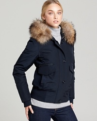 A classic bomber silhouette is dressed up with luxe raccoon fur trim. From WOOLRICH JOHN RICH & BROS. A classic bomber silhouette is dressed up with luxe raccoon fur trim. From WOOLRICH JOHN RICH & BROS.