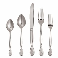 18/10 stainless, hollow handle knife with a graceful ribbon motif that curves around the tip of the handle. Beautifully compliments the playful bow motif of the dinnerware, stemware and giftware. 18/10 stainless, hollow handle knife with a graceful ribbon motif that curves around the tip of the handle. Beautifully compliments the playful bow motif of the dinnerware, stemware and giftware.