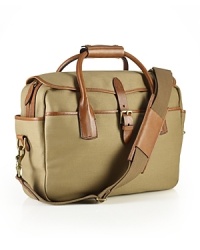 Drawing rustic inspiration from days spent in the great outdoors, a handsome bag is rendered in durable canvas with antiqued brass accents and burnished leather trim for an authentic, timeworn look. Drawing rustic inspiration from days spent in the great outdoors, a handsome bag is rendered in durable canvas with antiqued brass accents and burnished leather trim for an authentic, timeworn look.